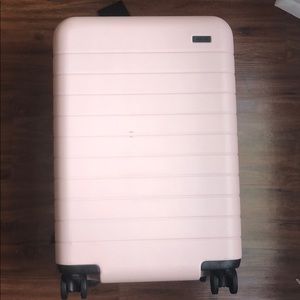 Away light pink bigger carryon